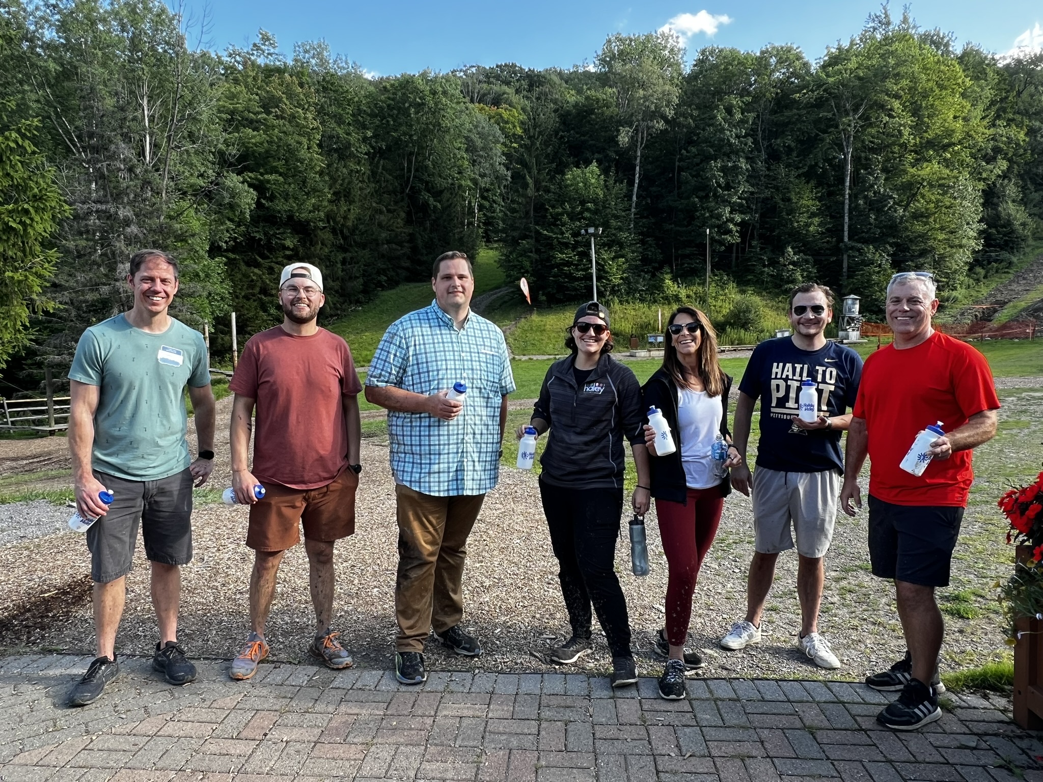 Haley Marketing teammates lined up outdoors during a company outing